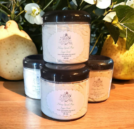 A photo of four jars of handmade sugar scrub from Enchanted Gardens Soapery